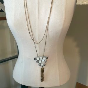 Two strand adjustable necklace with beautiful setting and tassel